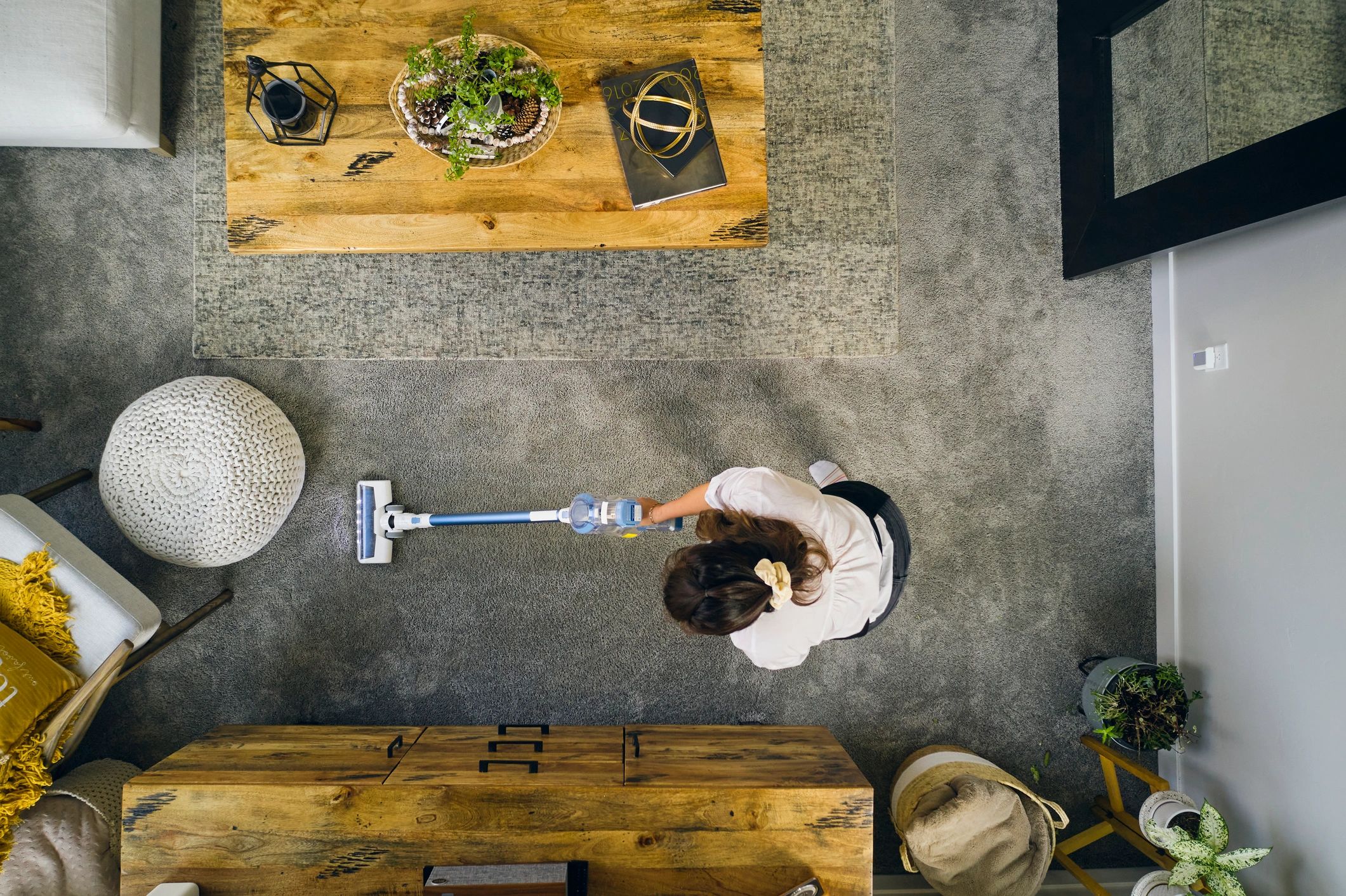 Professional housecleaner at work in a home